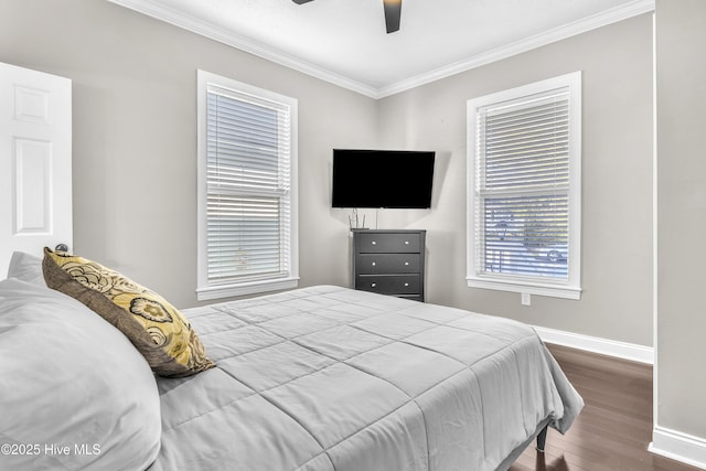 bedroom with a ceiling fan, baseboards, ornamental molding, and wood finished floors