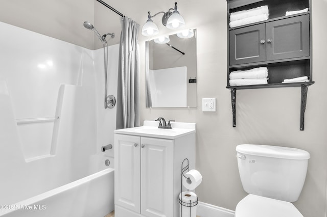 bathroom featuring shower / tub combo with curtain, vanity, and toilet