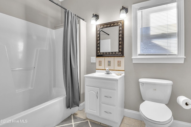 bathroom with shower / tub combo, baseboards, toilet, tile patterned floors, and vanity