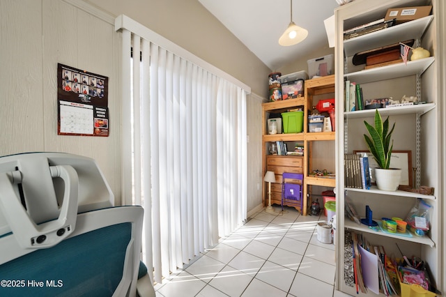 interior space featuring vaulted ceiling and light tile patterned floors