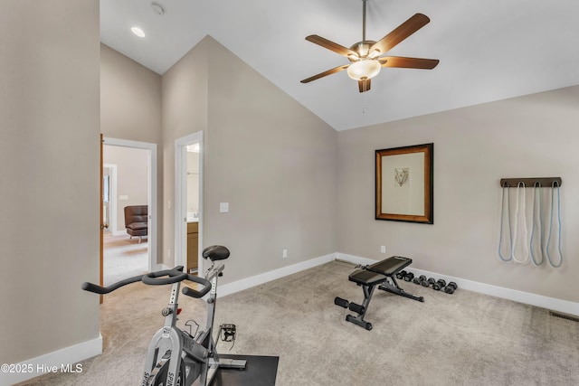 exercise area featuring carpet floors, ceiling fan, and baseboards