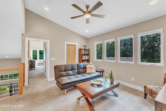 living room featuring light carpet, baseboards, vaulted ceiling, and recessed lighting