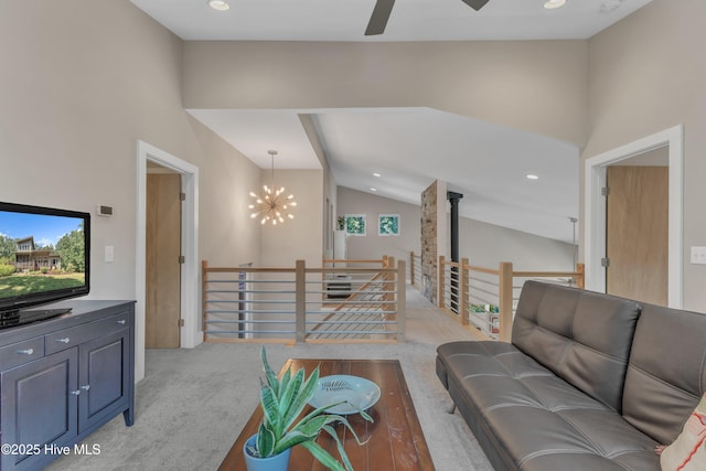 living area featuring light carpet, high vaulted ceiling, ceiling fan with notable chandelier, and recessed lighting