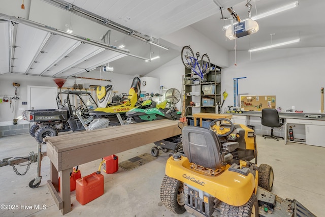 garage with a workshop area and a garage door opener