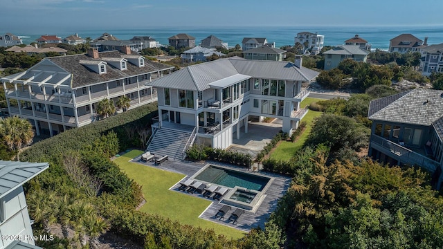 bird's eye view with a residential view and a water view