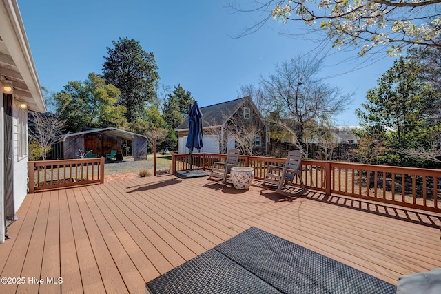 wooden deck featuring an outdoor structure