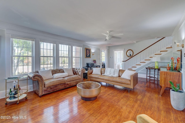 living room featuring stairs and wood finished floors