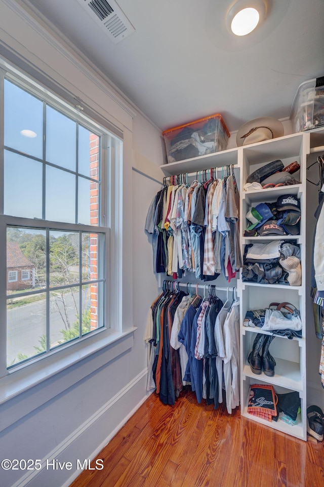 spacious closet with wood finished floors and visible vents