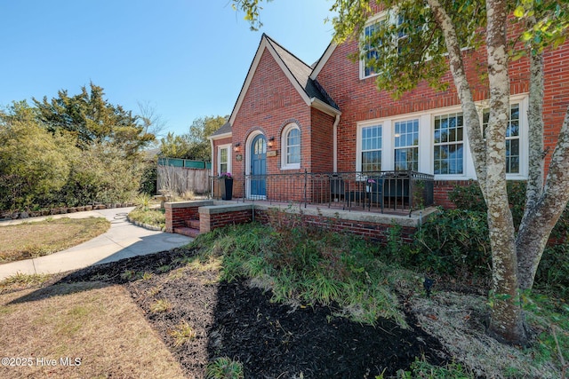 tudor home with brick siding