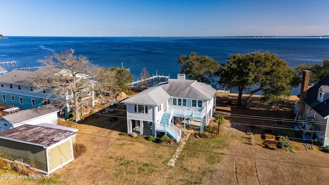 drone / aerial view with a water view