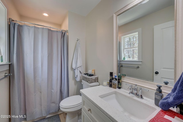 bathroom featuring recessed lighting, a shower with shower curtain, vanity, and toilet