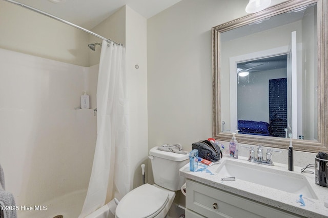 full bath with toilet, a stall shower, and vanity