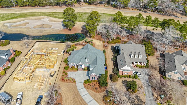 aerial view featuring a water view and a residential view