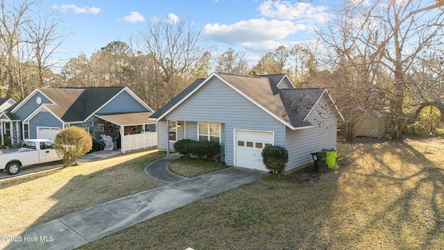 view of front facade with a garage, a front yard, concrete driveway, and a shingled roof