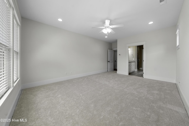 unfurnished bedroom with multiple windows, recessed lighting, and baseboards