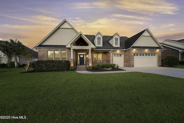 view of front facade featuring a garage, a front lawn, concrete driveway, and brick siding