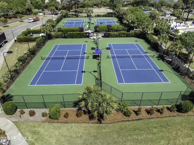 view of tennis court with fence