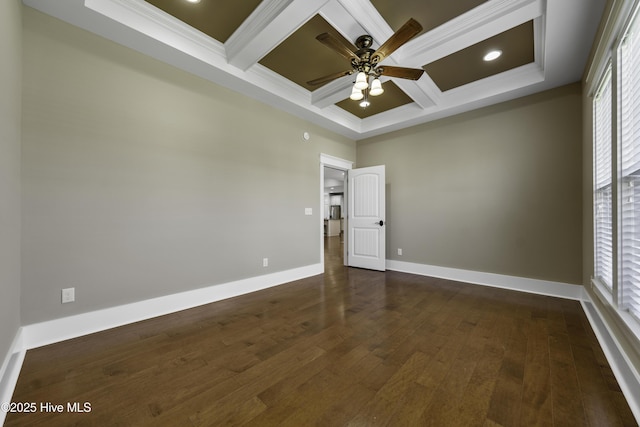 unfurnished room with dark wood finished floors, crown molding, a wealth of natural light, coffered ceiling, and baseboards