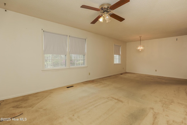 204 Columbia Dr, Jacksonville, NC 28546 - interior details featuring carpet flooring, visible vents, wooden walls, beamed ceiling, and a brick fireplace