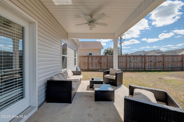 view of patio / terrace with outdoor lounge area, a fenced backyard, and ceiling fan