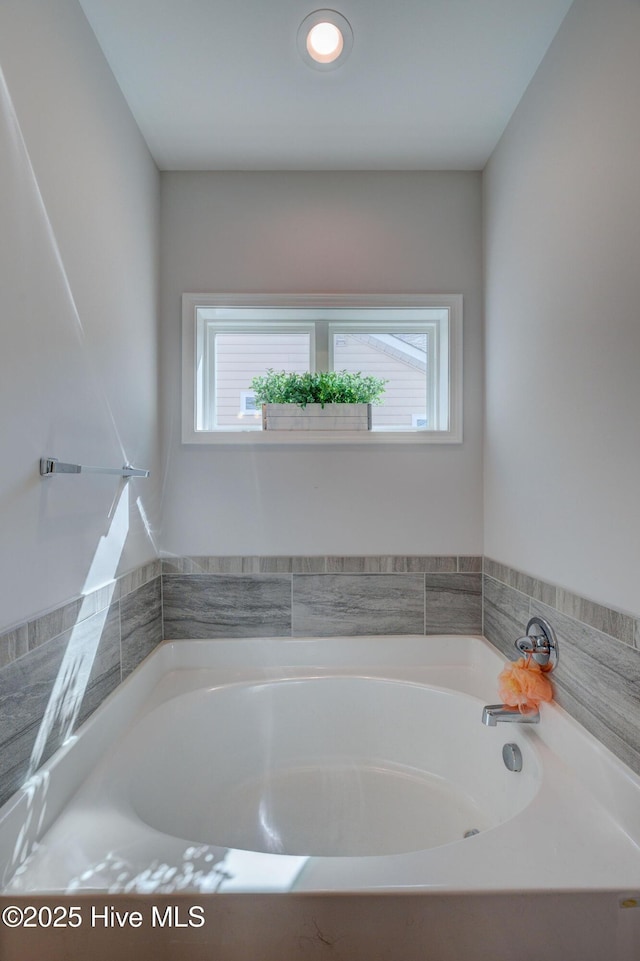 bathroom featuring a garden tub