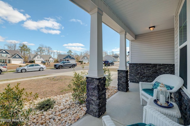 view of patio featuring a residential view and covered porch