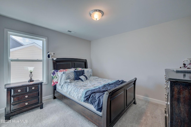 bedroom featuring visible vents, baseboards, and carpet floors