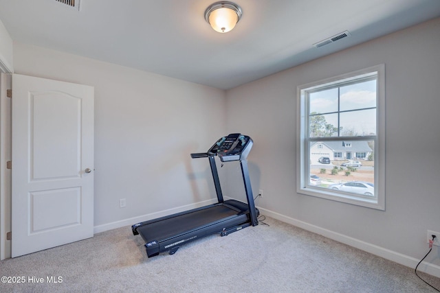 workout room with visible vents, carpet floors, and baseboards