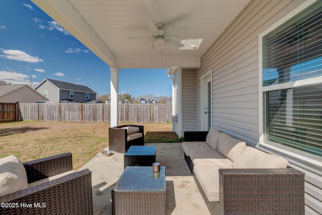 view of patio / terrace featuring an outdoor living space, ceiling fan, and a fenced backyard