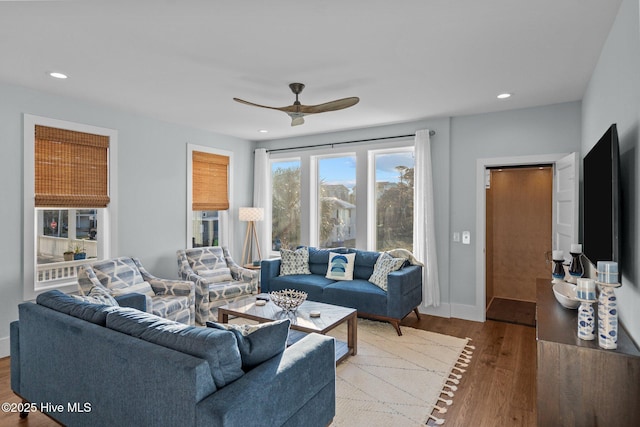 living area with ceiling fan, baseboards, wood finished floors, and recessed lighting