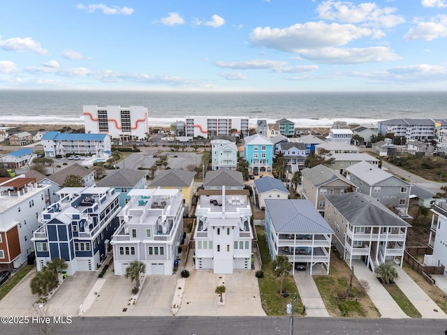 drone / aerial view with a residential view and a water view