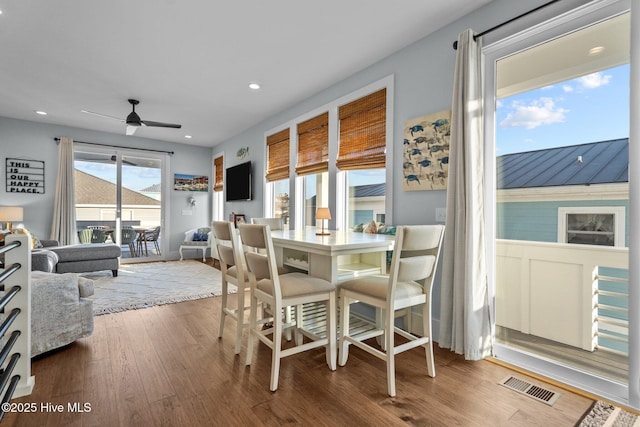 dining room featuring ceiling fan, visible vents, wood finished floors, and recessed lighting