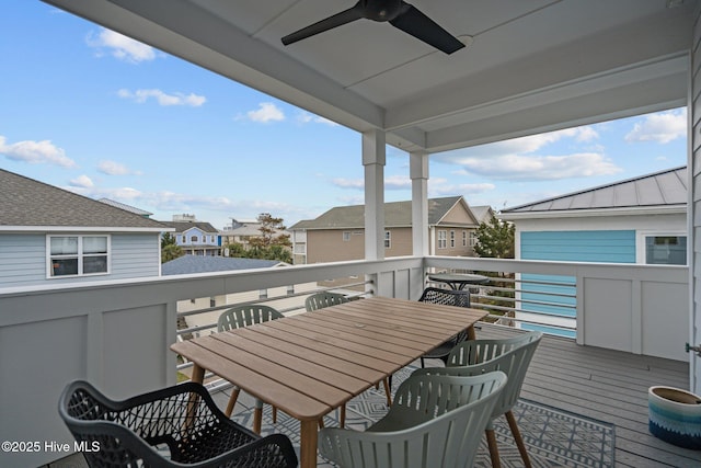 exterior space with outdoor dining space, a ceiling fan, and a residential view