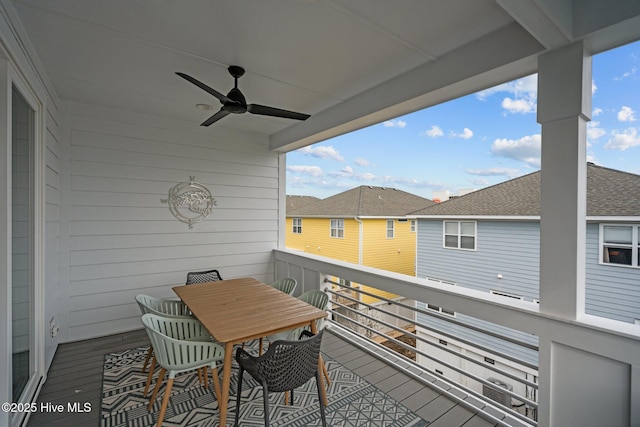 balcony featuring a residential view and ceiling fan