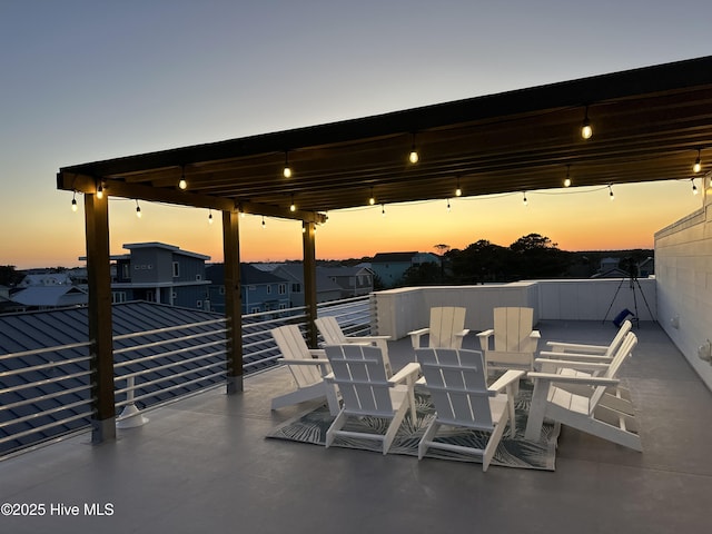 view of patio terrace at dusk