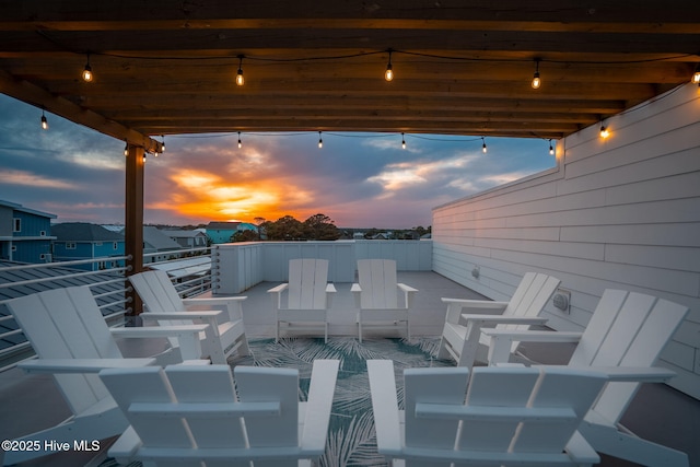 view of patio terrace at dusk