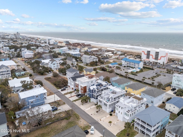 bird's eye view featuring a water view and a view of the beach