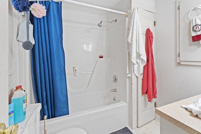 bathroom featuring shower / bath combination with curtain and vanity