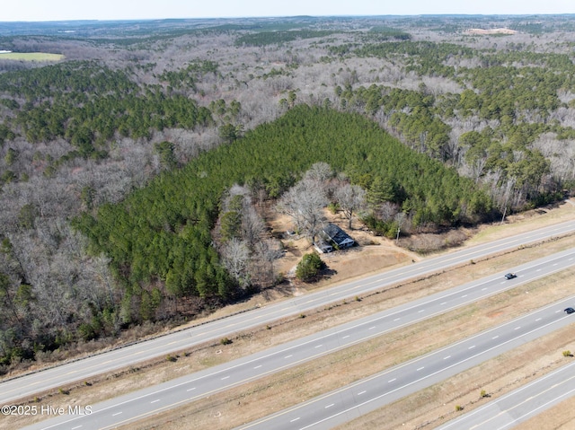 bird's eye view featuring a forest view