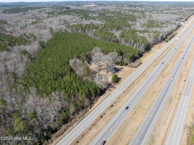 drone / aerial view with a view of trees