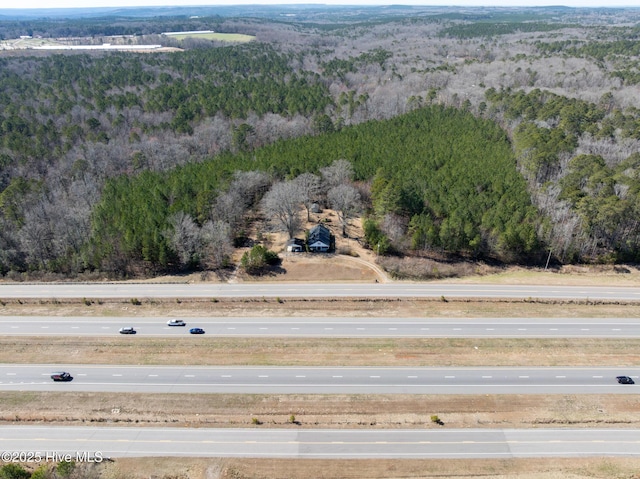 bird's eye view featuring a view of trees