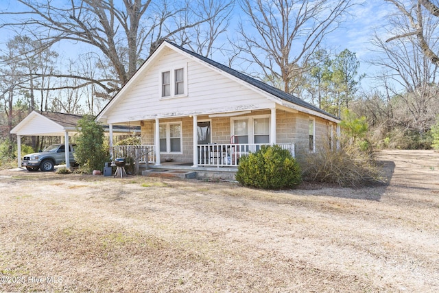 bungalow with a carport and covered porch