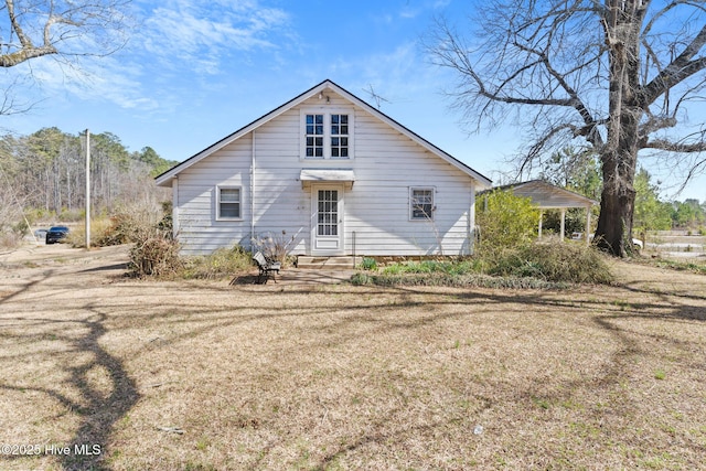 rear view of house featuring entry steps