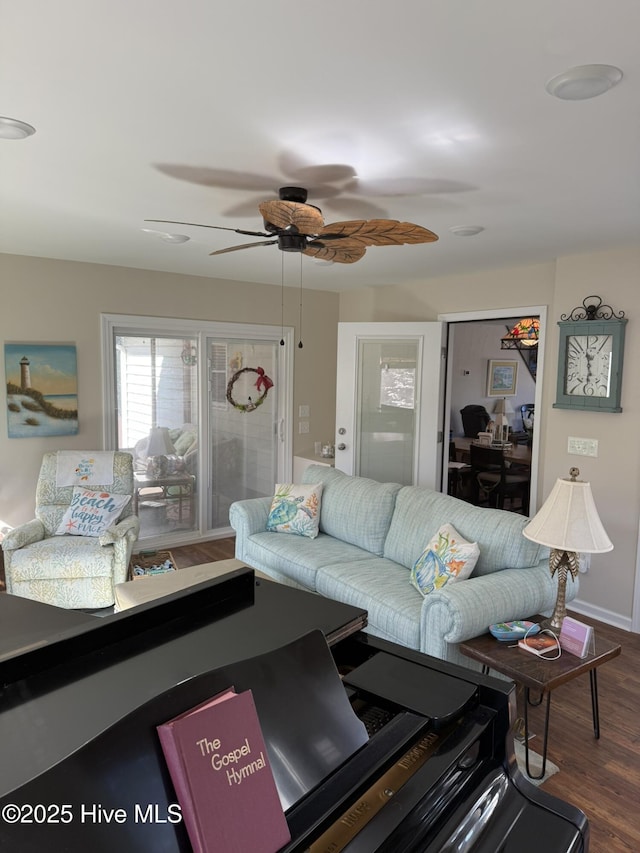 living room featuring ceiling fan and wood finished floors