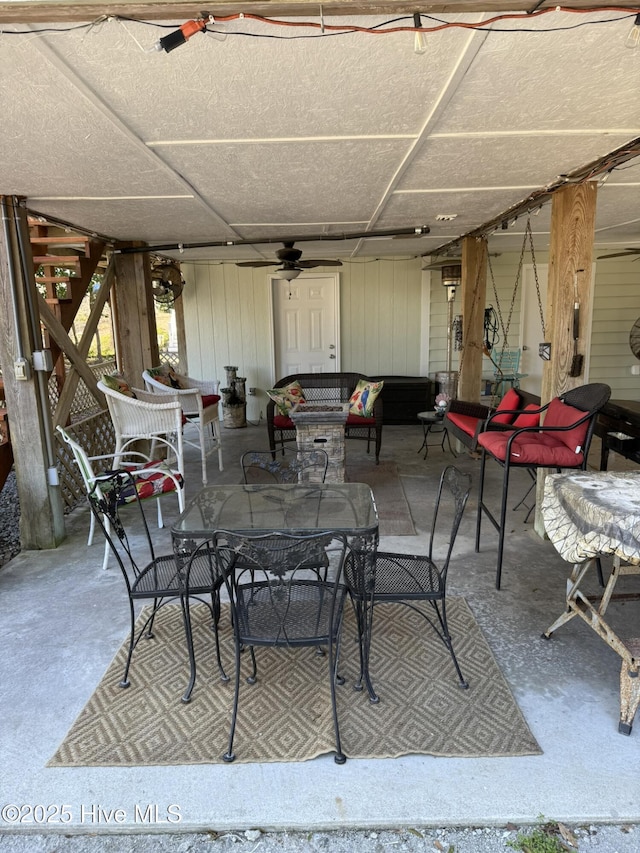 view of patio / terrace with an outdoor living space, outdoor dining area, and a ceiling fan