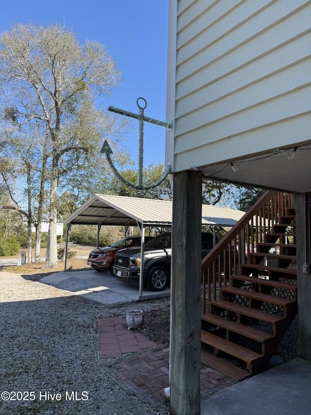 view of car parking featuring stairway