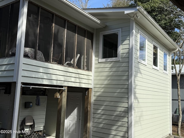 view of home's exterior featuring a sunroom