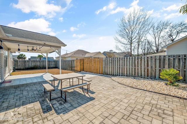 view of patio with ceiling fan and a fenced backyard