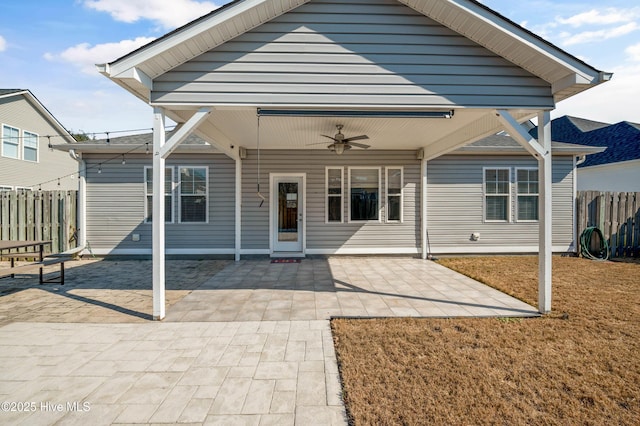 view of front facade featuring ceiling fan, a patio area, and fence