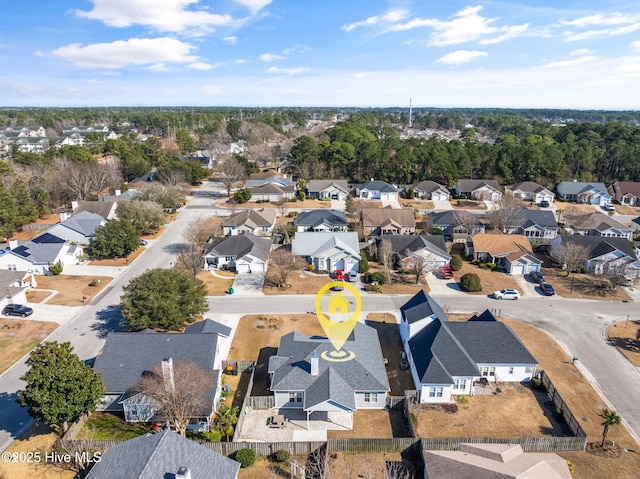 birds eye view of property with a residential view